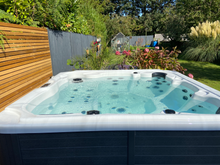 Load image into Gallery viewer, MAJORCA (USED) - This 6 seater family tub has 1 lounger, 1 massage pod and mounted Bluetooth speakers