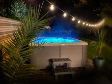 Load image into Gallery viewer, MAJORCA (USED) - This 6 seater family tub has 1 lounger, 1 massage pod and mounted Bluetooth speakers